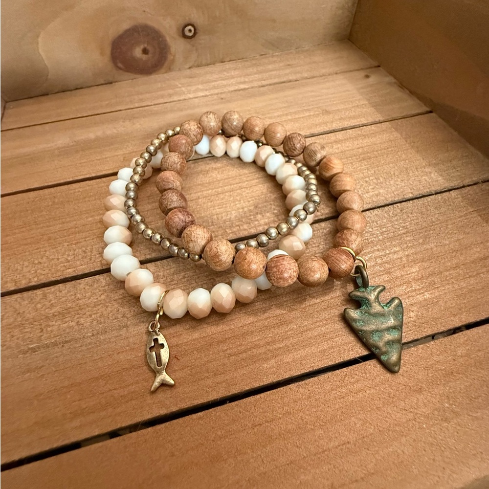 A mix of Wooden and Faceted Beaded Bracelet Set (of 3) with Charms